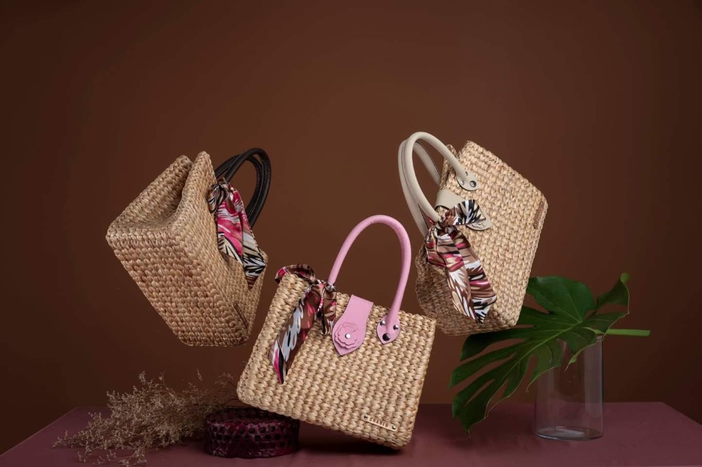 Minimal product photography of woven bags with clean styling and studio lighting